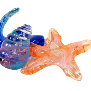 Colorful glass sculptures of a seashell and a starfish on a white background.